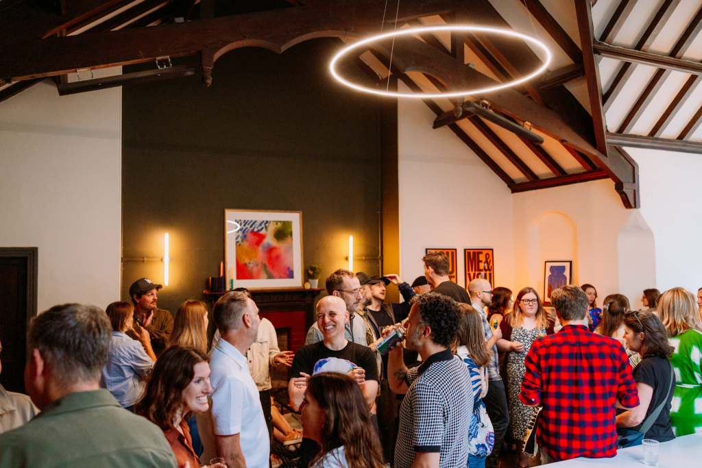 Image of a group of people stood at a bar in The Vestry room at Trinity Church