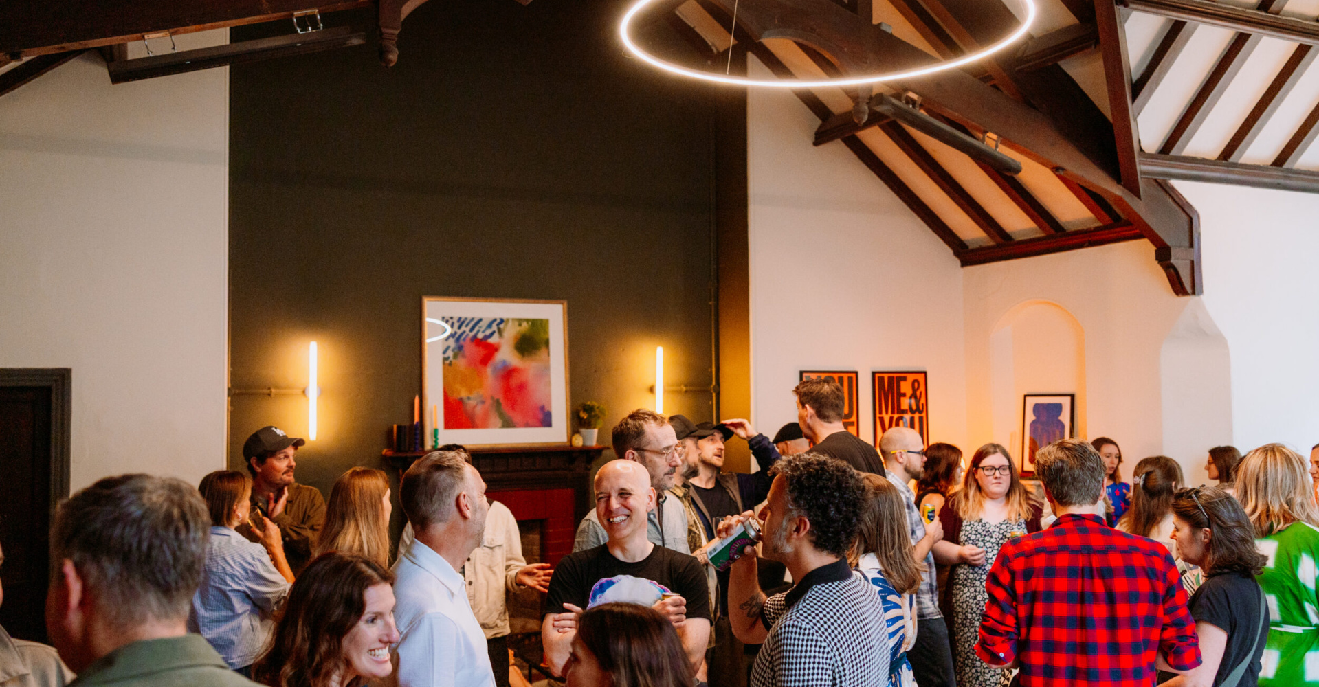 Image of a group of people stood at a bar in The Vestry room at Trinity Church