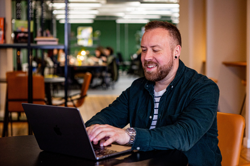 Jason Smith at his computer Gather Round