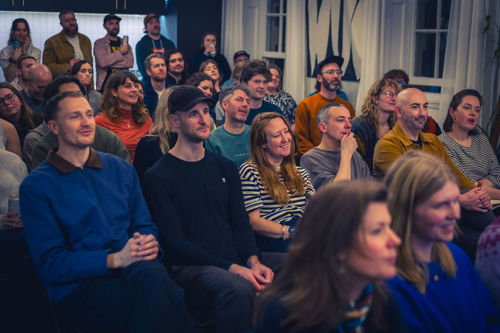 Audience laughing at Gather Round event Brunswick Sq