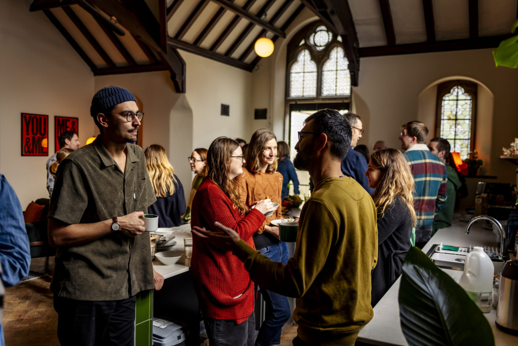 Image of the community at a family breakfast, at Trinity Church coworking space in Bath