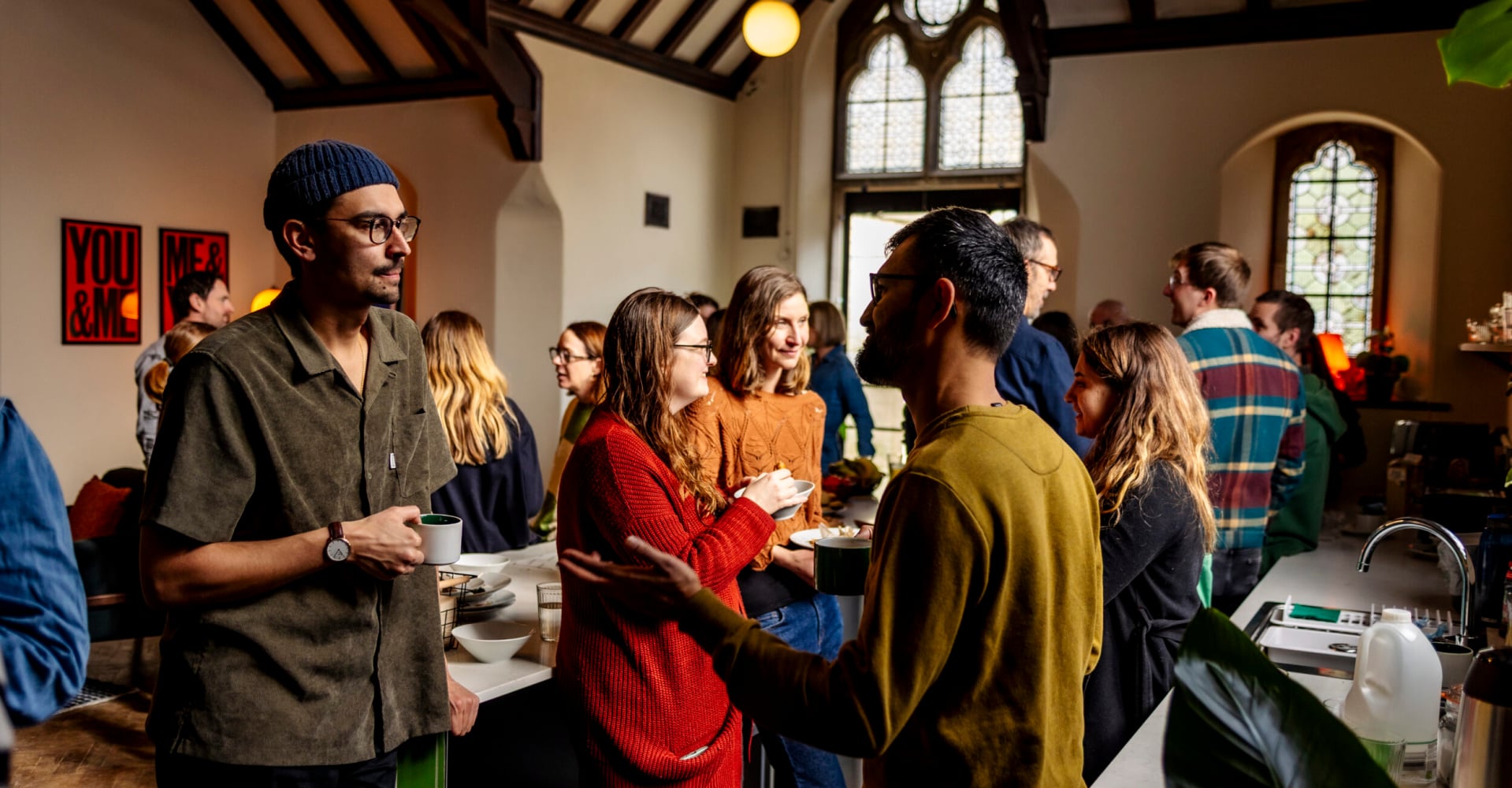 Image of the community at a family breakfast, at Trinity Church coworking space in Bath